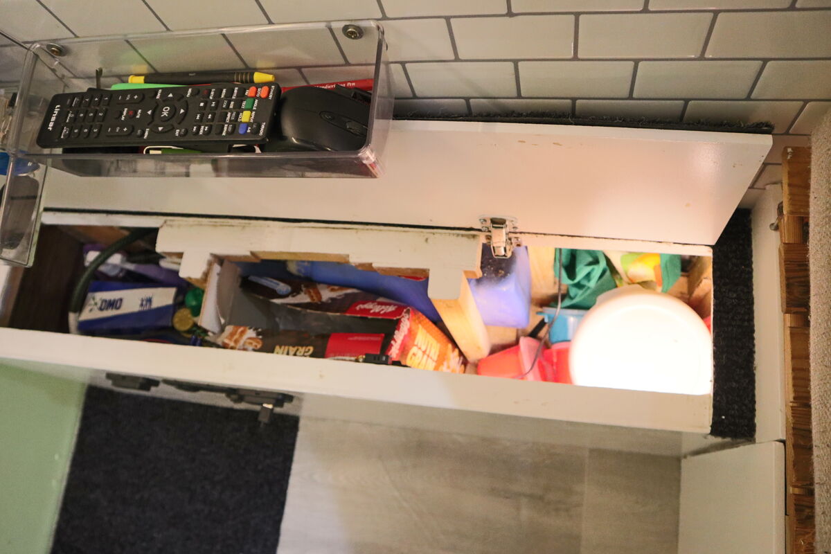 Storage area around the water tank